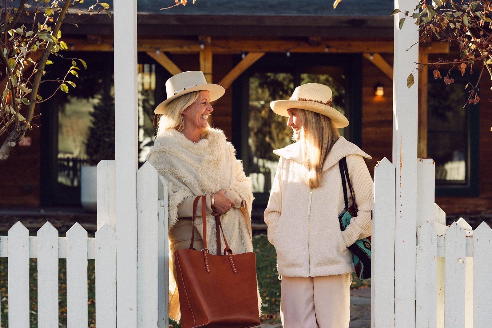 The Alpine House exterior, with two ladies smiling.